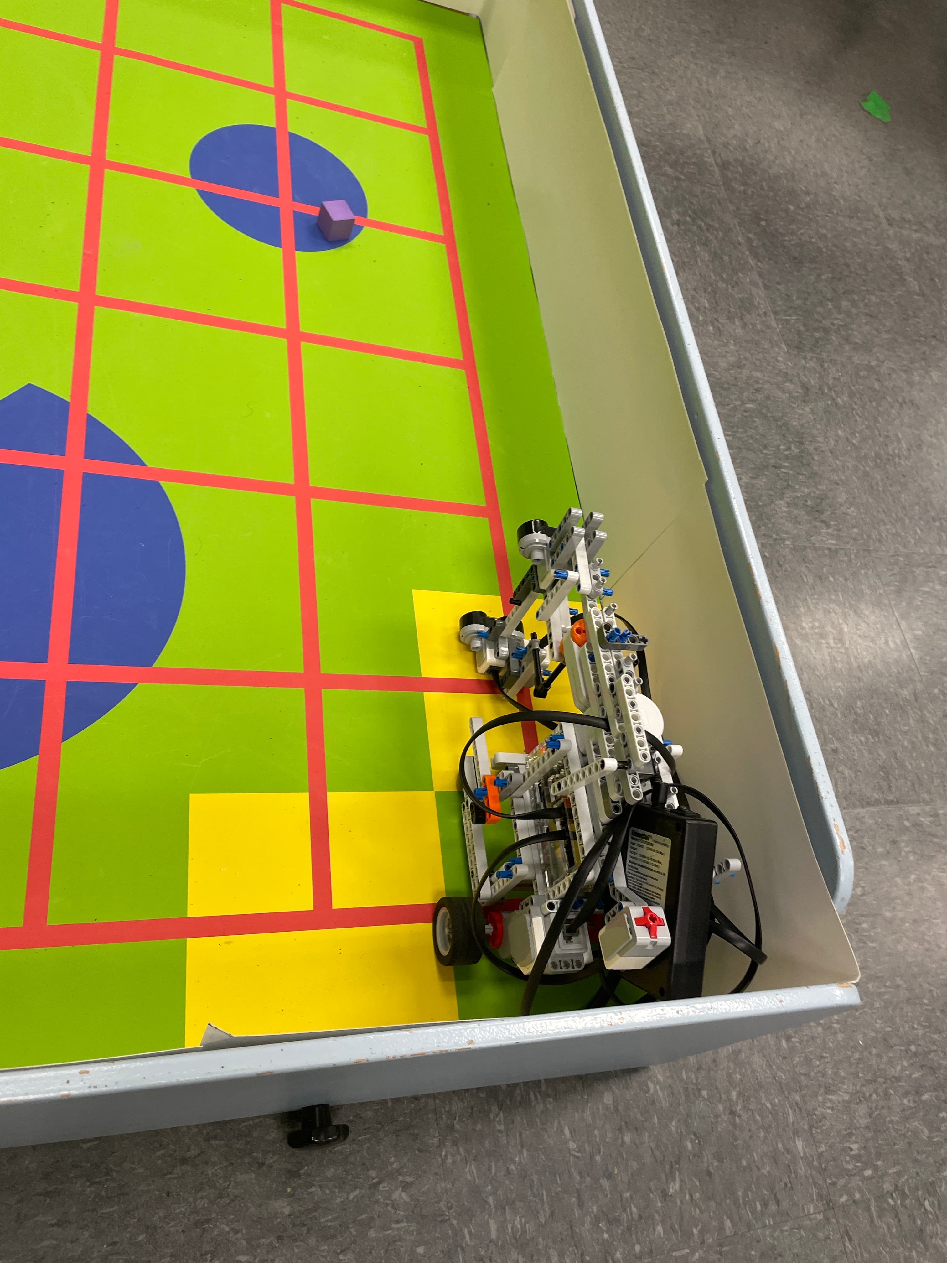Hamza building a robotics project